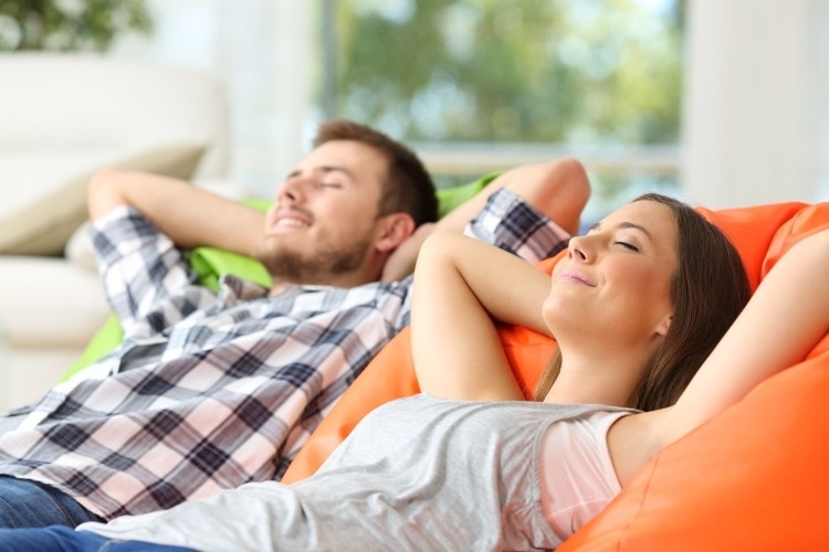 couple-or-roommates-relaxing-at-home-picture-id638657234