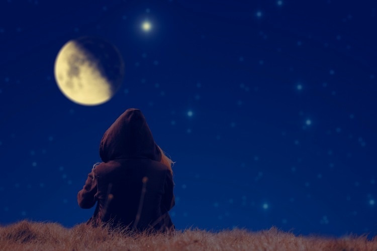 lonesome-girl-spectating-moonset-on-a-starry-skies-picture-id538828423_1