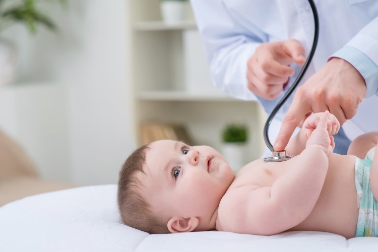professional-pediatrician-examining-infant-picture-id508509000
