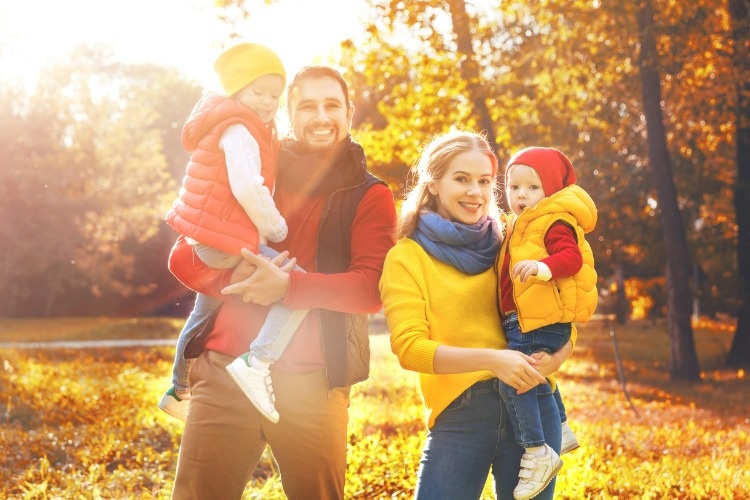 happy-family-mother-father-and-children-on-an-autumn-walk-picture-id854396342