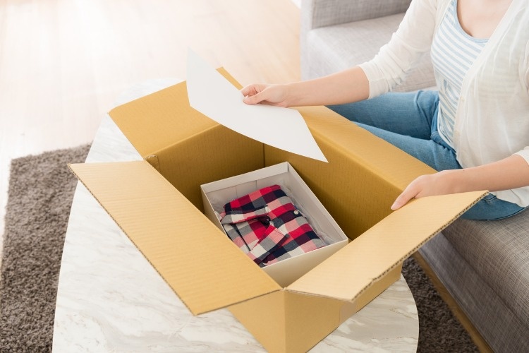 woman-opening-personal-online-shopping-parcel-picture-id1015255538_02
