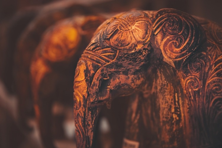 little-wooden-elephants-with-artistically-carved-drawings-picture-id1014790756