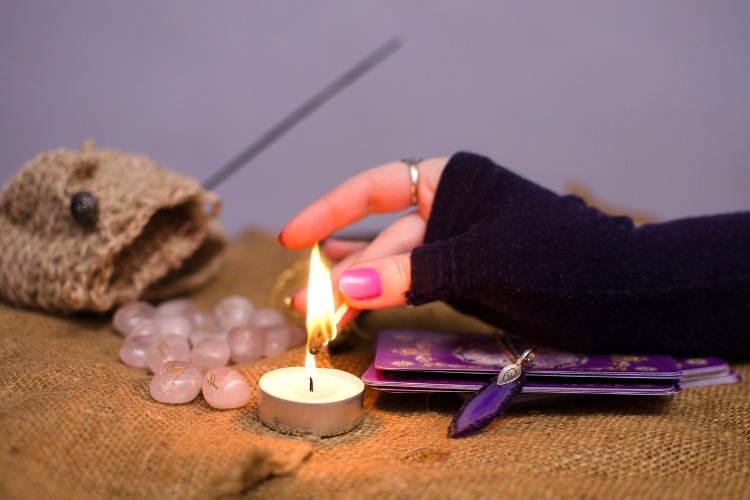 lights-a-candle-for-divination-picture-id468576080_02